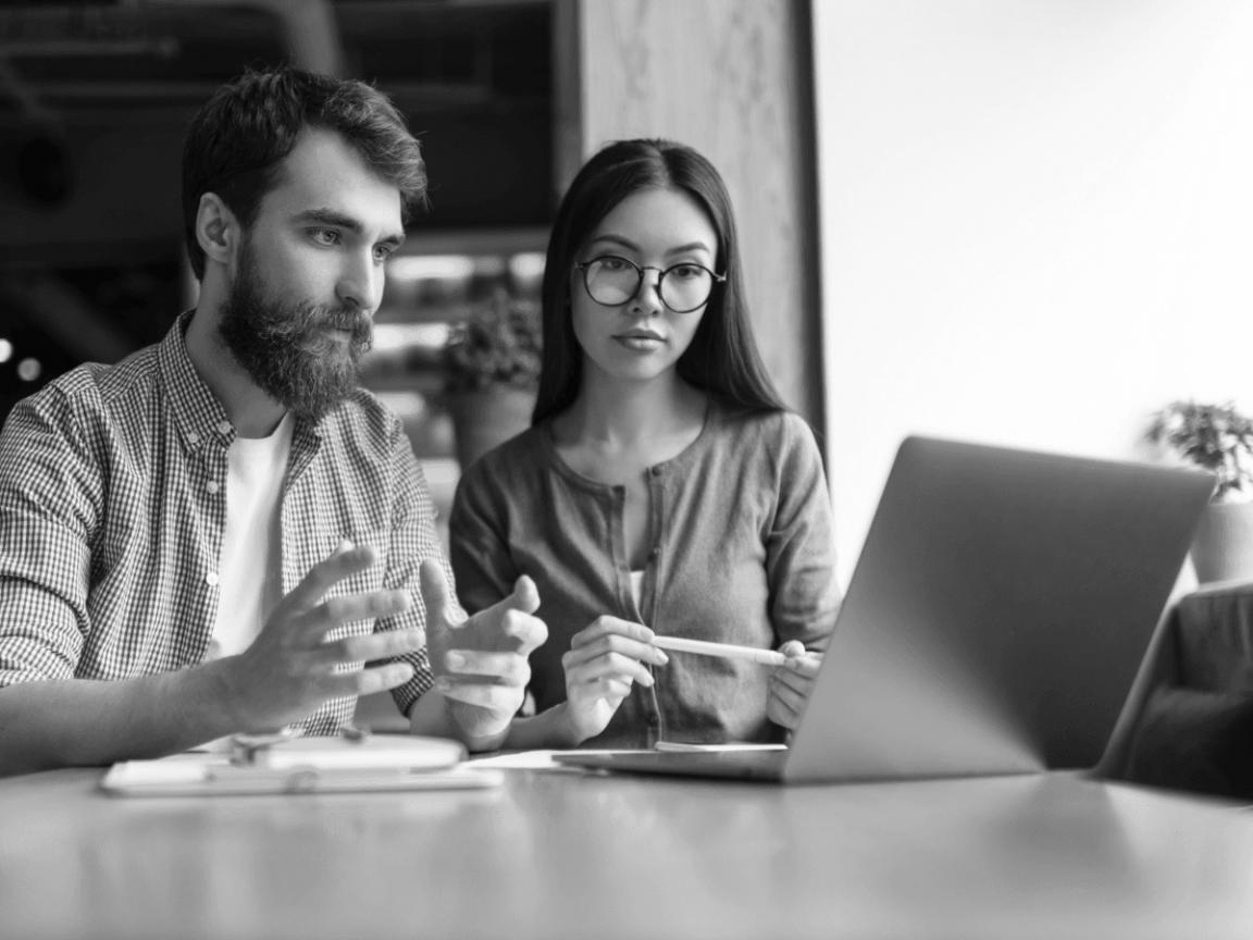 Instructor reviewing audit framework on workshop whiteboard